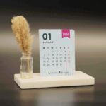 cute desk calendar 2026 with vibrant colors on a marble base and pampas grass