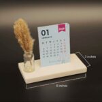 cute desk calendar 2026 with vibrant colors on a marble base and pampas grass
