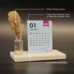 cute desk calendar 2026 with vibrant colors on a marble base and pampas grass