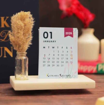 cute desk calendar 2026 with vibrant colors on a marble base and pampas grass